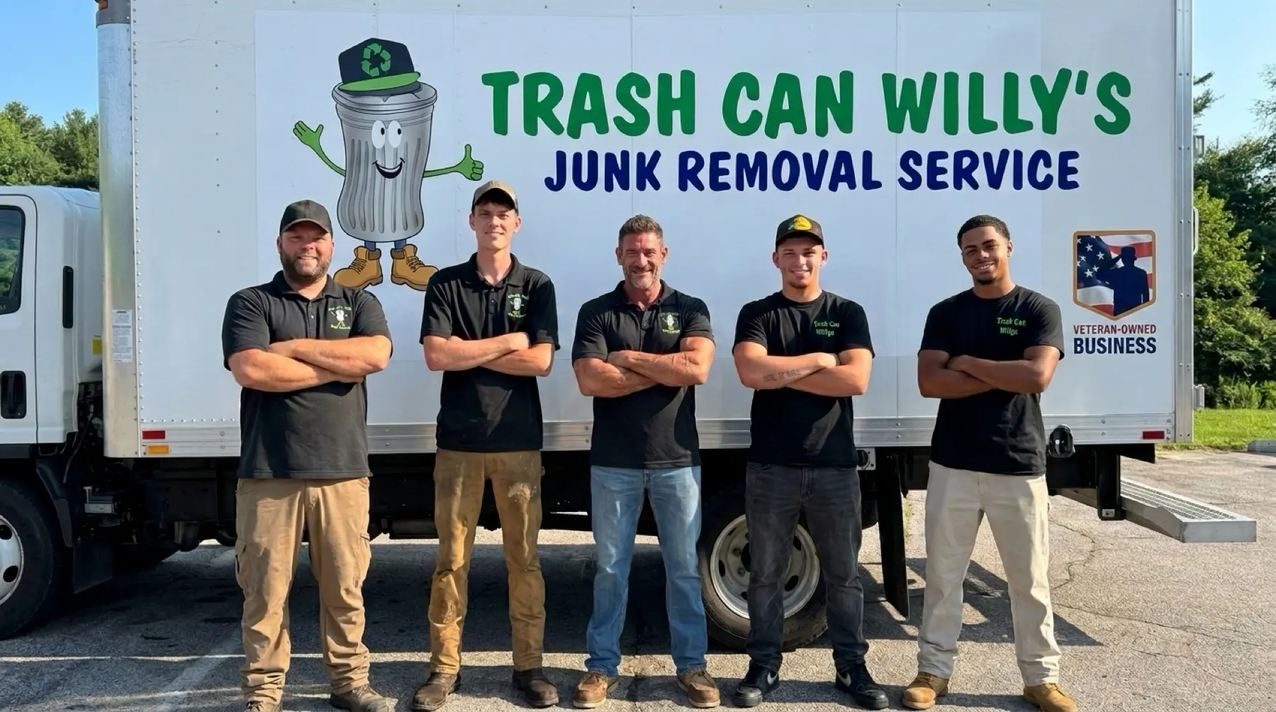 The Trash Can Willy's crew in front of the branded box truck